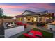 Large backyard with firepit, outdoor kitchen, and plenty of seating at 20428 W Elm Dr, Buckeye, AZ 85396