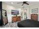 Main bedroom with dresser, large TV and ensuite bathroom access at 20428 W Elm Dr, Buckeye, AZ 85396