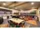 Outdoor kitchen and patio furniture under a covered patio with mountain views at 20428 W Elm Dr, Buckeye, AZ 85396