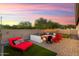 Relaxing patio seating area with fire pit and comfortable lounge chairs at 20428 W Elm Dr, Buckeye, AZ 85396