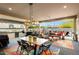 Outdoor kitchen and dining area with seating for six at 20428 W Elm Dr, Buckeye, AZ 85396