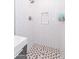 Clean walk-in shower with hexagon tile floor and subway tile walls at 7544 E Mckinley St, Scottsdale, AZ 85257
