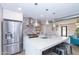 Modern kitchen boasts stainless steel appliances and a large island at 7544 E Mckinley St, Scottsdale, AZ 85257