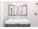 Clean bathroom with double vanity and gray framed mirrors at 7544 E Mckinley St, Scottsdale, AZ 85257