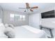 Bright bedroom with king bed, mounted TV, and sliding closet doors at 7544 E Mckinley St, Scottsdale, AZ 85257