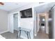 Bright bedroom with tile floors, a ceiling fan, and a large closet at 7544 E Mckinley St, Scottsdale, AZ 85257