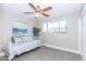 Bedroom with daybed, ceiling fan, and gray tile floors at 7544 E Mckinley St, Scottsdale, AZ 85257