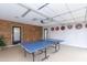 Game room in garage with ping pong table at 7544 E Mckinley St, Scottsdale, AZ 85257