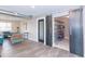 Hallway with barn doors revealing laundry and storage area at 7544 E Mckinley St, Scottsdale, AZ 85257