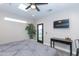 Main bedroom with king bed, backyard access, and ceiling fan at 7544 E Mckinley St, Scottsdale, AZ 85257