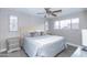 Spacious bedroom with a king-size bed, ceiling fan, and plenty of natural light at 7544 E Mckinley St, Scottsdale, AZ 85257