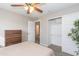 Bedroom with queen bed, ceiling fan, and access to bathroom at 7544 E Mckinley St, Scottsdale, AZ 85257