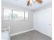 Bedroom with window, ceiling fan, and sliding closet doors at 7544 E Mckinley St, Scottsdale, AZ 85257