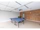Garage with ping pong table and wood accent wall at 7544 E Mckinley St, Scottsdale, AZ 85257
