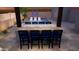 Outdoor kitchen with fire pit and bar seating at 15898 S 177Th Dr, Goodyear, AZ 85338