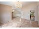 Formal dining room with chandelier and tiled floors at 591 E Park Ave, Gilbert, AZ 85234