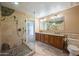 Bathroom with double vanity, granite countertops and a large shower at 591 E Park Ave, Gilbert, AZ 85234
