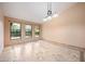 Bright dining room with large windows and tiled floors at 591 E Park Ave, Gilbert, AZ 85234