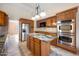 Kitchen with granite island and stainless steel appliances at 591 E Park Ave, Gilbert, AZ 85234
