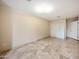 Spacious bedroom with tile flooring and built-in closet at 591 E Park Ave, Gilbert, AZ 85234
