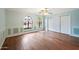 Bedroom with hardwood floors, large closets and arched windows at 591 E Park Ave, Gilbert, AZ 85234