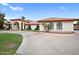 Front view of a Spanish style home showcasing its landscaping and driveway at 591 E Park Ave, Gilbert, AZ 85234