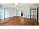 Light and airy bedroom with hardwood floors and built-in closet at 591 E Park Ave, Gilbert, AZ 85234