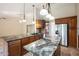 Spacious kitchen featuring granite countertops and stainless steel appliances at 591 E Park Ave, Gilbert, AZ 85234