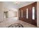 Spacious entryway with double doors and chandelier at 591 E Park Ave, Gilbert, AZ 85234