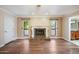Living area with hardwood floors and ornate fireplace at 591 E Park Ave, Gilbert, AZ 85234