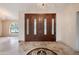 Elegant entryway with double doors and a beautiful tiled floor at 591 E Park Ave, Gilbert, AZ 85234