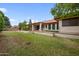 Large backyard with grassy area and covered patio at 591 E Park Ave, Gilbert, AZ 85234
