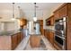 Spacious kitchen with granite countertops and wood cabinets at 591 E Park Ave, Gilbert, AZ 85234