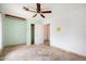 Spacious bedroom with light walls, tile floors and a large closet at 591 E Park Ave, Gilbert, AZ 85234