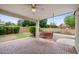 Brick patio with covered seating area and backyard access at 591 E Park Ave, Gilbert, AZ 85234