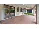 Covered patio with sliding glass doors and artificial turf at 591 E Park Ave, Gilbert, AZ 85234