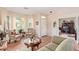 Bright living room with bay window and comfortable seating at 17800 W Primrose Ln, Surprise, AZ 85374