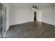 Living room with wood-look floors and sliding glass doors at 950 E 10Th Pl, Mesa, AZ 85203