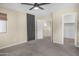 Primary bedroom with ceiling fan, carpet flooring, and walk-in closet at 3532 W Warren Ln, Anthem, AZ 85086