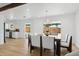 Open concept dining room with kitchen view and access to backyard at 1455 E Tuckey Ln, Phoenix, AZ 85014