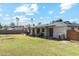 Large backyard with grassy area and a covered patio at 1455 E Tuckey Ln, Phoenix, AZ 85014