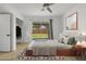 Spacious bedroom with wood floors and sliding glass doors to backyard at 1455 E Tuckey Ln, Phoenix, AZ 85014