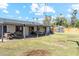 Spacious backyard with grassy area and covered patio at 1455 E Tuckey Ln, Phoenix, AZ 85014