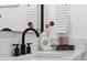 Modern bathroom with marble countertop and black fixtures at 1455 E Tuckey Ln, Phoenix, AZ 85014