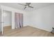 Spacious bedroom with light flooring and access to another room at 1455 E Tuckey Ln, Phoenix, AZ 85014
