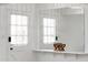 Entryway with a built-in shelf, white walls, and a door with window at 1455 E Tuckey Ln, Phoenix, AZ 85014