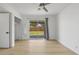 Bright bedroom with wood floors and sliding glass doors to backyard at 1455 E Tuckey Ln, Phoenix, AZ 85014
