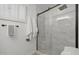 Clean bathroom with a walk-in shower and marble tile at 1455 E Tuckey Ln, Phoenix, AZ 85014