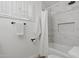 Clean bathroom with marble tile and a shower/tub combo at 1455 E Tuckey Ln, Phoenix, AZ 85014
