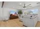 Living room featuring a large TV, sectional sofa, and hardwood floors at 1455 E Tuckey Ln, Phoenix, AZ 85014